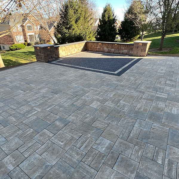 Paver walkway bordered by plants